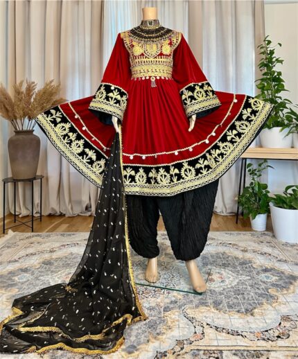 Afghan traditional dress in Sorkh Makhmal with chest Charmadozi and Sekeh-dozi, finished with Siah Geybi shalwar and Siah Gaj shal, free size (EU 36–42).