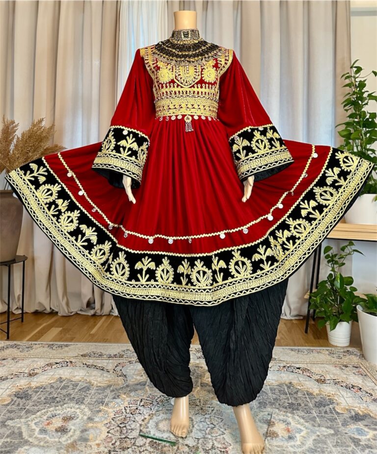 Afghan traditional dress in Sorkh Makhmal with chest Charmadozi and Sekeh-dozi, finished with Siah Geybi shalwar and Siah Gaj shal, free size (EU 36–42).