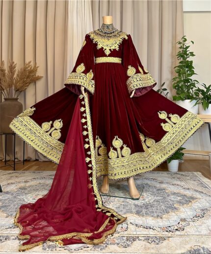 Long maroon (burgundy) Makhmal dress with refined leatherwork on neckline, hem, and sleeves, paired with maroon gaj shal and maroon crepe pants. Adjustable waist belt. Free size (EU 36–42).