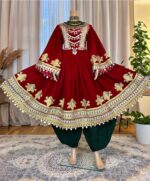 Maroon Makhmal dress with Charmadozi on chest, skirt, and sleeves. Comes with green Gaj shal and green Gibi shalwar. Free size (EU 36–42)